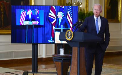 На фото: президент США Джо Байден и премьер-министр Австралии Скотт Моррисон (слева) во время совместной видеоконференции с премьер-министром Великобритании Борисом Джонсоном.