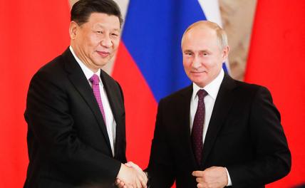 На фото: председатель КНР Си Цзиньпин и президент РФ Владимир Путин (слева направо)