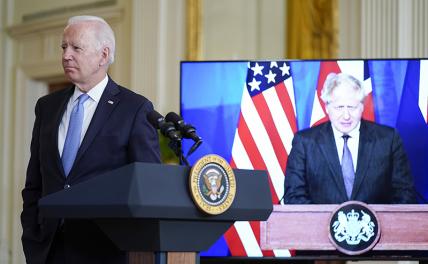На фото: президент США Джо Байден и премьер-министр Великобритании Борис Джонсон (справа) во время совместной видеоконференции с премьер-министром Австралии Скоттом Моррисоном