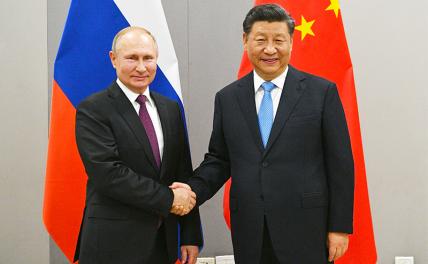 На фото: президент РФ Владимир Путин и председатель КНР Си Цзиньпин (слева направо) во время встречи.