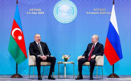 На фото: президент РФ Владимир Путин и президент Азербайджана Ильхам Алиев (справа налево) во время встречи в рамках саммита Шанхайской организации сотрудничества (ШОС).