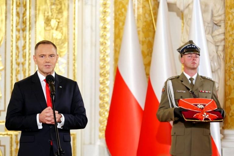 На фото: новоизбранный президент Польши Кароль Навроцкий 6 августа принес присягу перед Сеймом &mdash; парламентом страны.